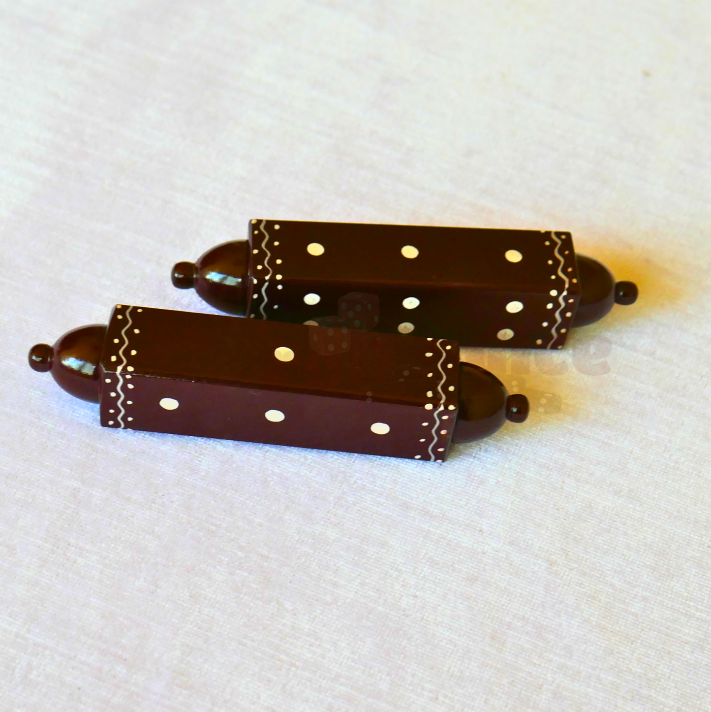 Brown Special daaLa long dice by Roll the Dice, featuring a detailed, elongated design for gaming and tabletop use.
