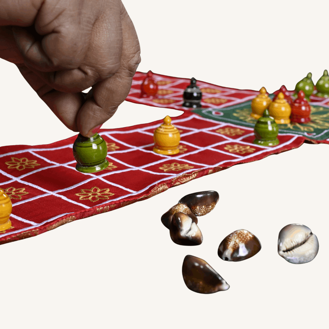 Traditional Indian Pachisi board game by Roll the Dice, showing the colorful Chausar layout on a wooden game board.