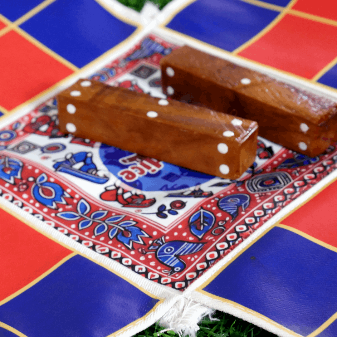 Colorful Pagade Indian board game set with traditional Pachisi design, featuring four vibrant color options from Roll the Dice.