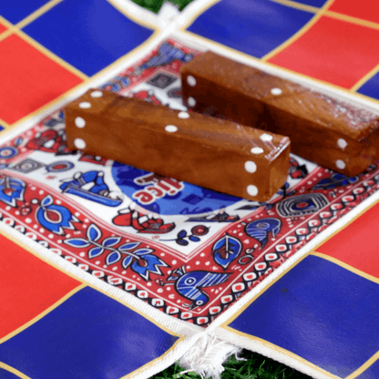 Colorful Pagade Indian board game set with traditional Pachisi design, featuring four vibrant color options from Roll the Dice.
