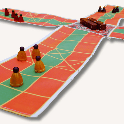 Colorful Pagade Indian board game set by Roll the Dice featuring traditional Pachisi design on a wooden game board.