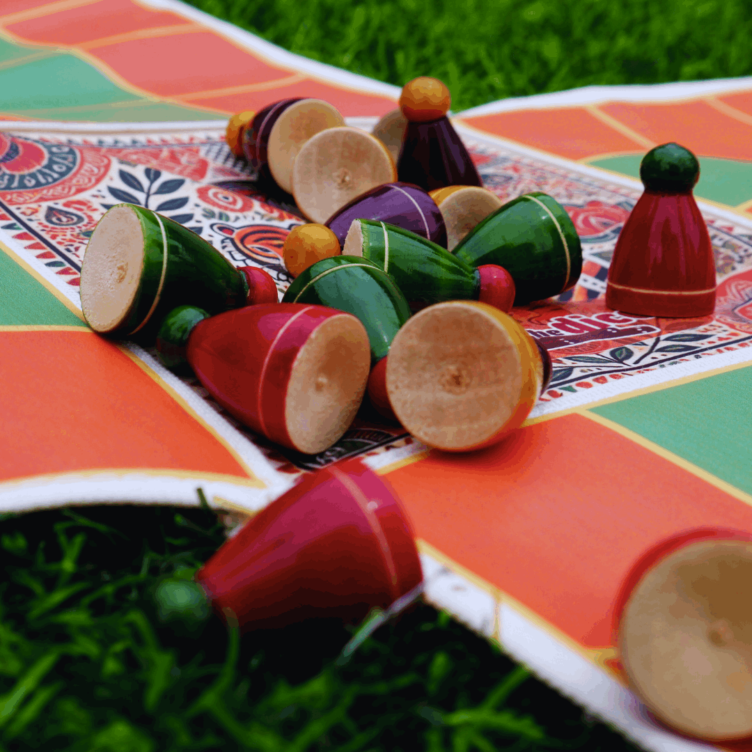 Roll the Dice Pagade classic Indian board game in four colors, featuring traditional Pachisi design and wooden game pieces.