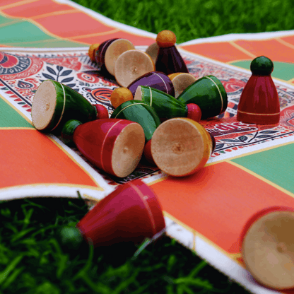 Roll the Dice Pagade classic Indian board game in four colors, featuring traditional Pachisi design and wooden game pieces.