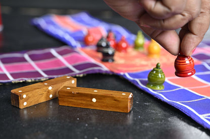 Pachisi board game by Roll the Dice, featuring traditional wooden game pieces on a colorful game board for family fun.
