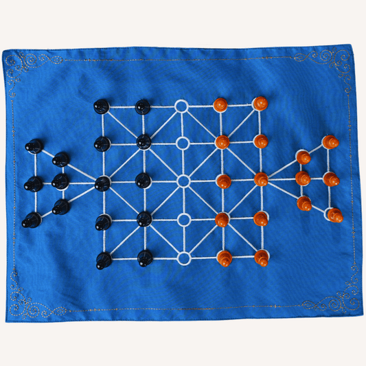 Sixteen soldiers in a board game setup by Roll the Dice, featuring colorful game pieces and traditional SholoGutti elements.