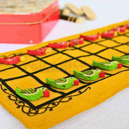 Traditional Taabla board game from Roll the Dice featuring a wooden game board with numbered sections and game pieces.