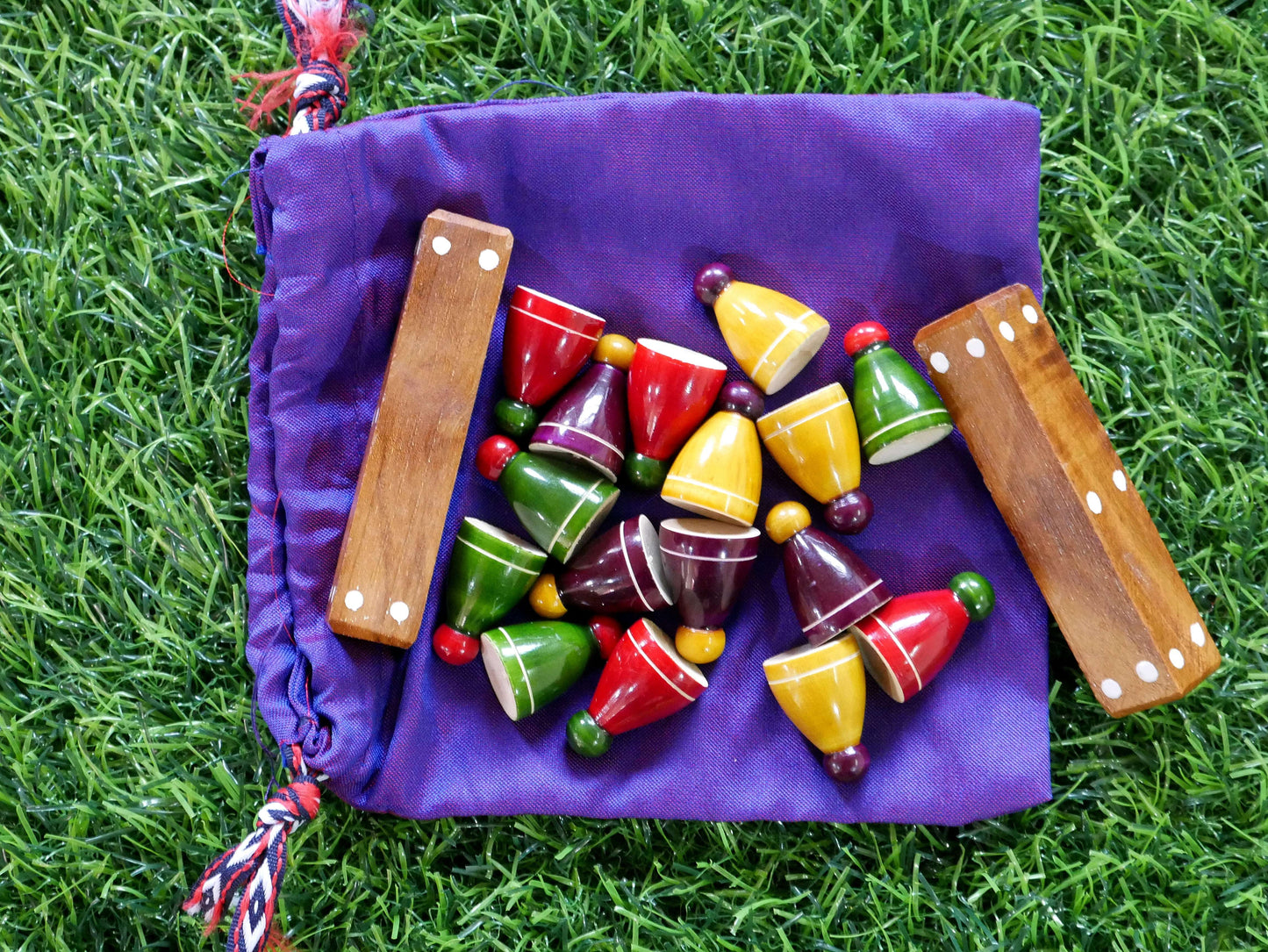 Colorful Pagade Indian board game set with traditional pawns in four vibrant colors for classic Pachisi gameplay.